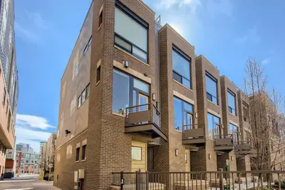 a brick building with balconies on a street at 2900 Inca St 20 in Denver