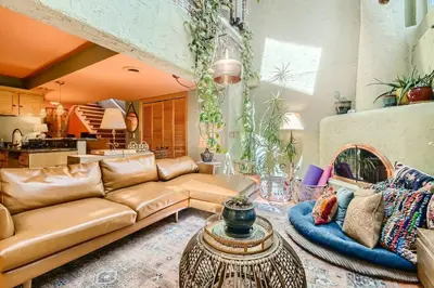 a living room with a couch and a table at 1374 S Pennsylvania St in Denver