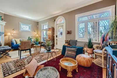 a living room filled with lots of furniture and windows at 1374 S Pennsylvania St in Denver