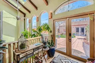 a house with a balcony with a bird cage on it at 1374 S Pennsylvania St in Denver