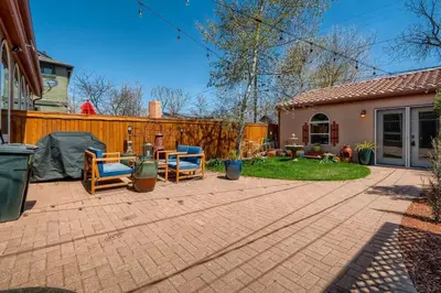 a backyard with two chairs and a fence at 1374 S Pennsylvania St in Denver