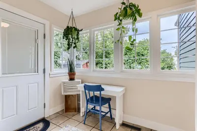 a home office with a desk and windows at 113 4th Ave in Longmont