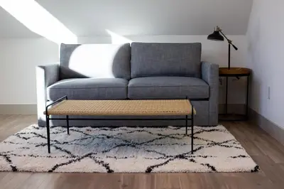 a living room with a couch and a coffee table at 139 West Ellsworth in Denver