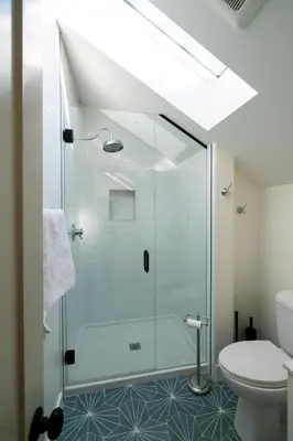 a bathroom with a shower and a toilet at 139 West Ellsworth in Denver