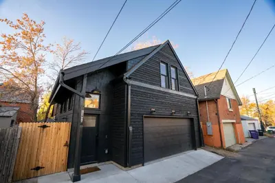 a black brick house with a garage at 139 West Ellsworth in Denver