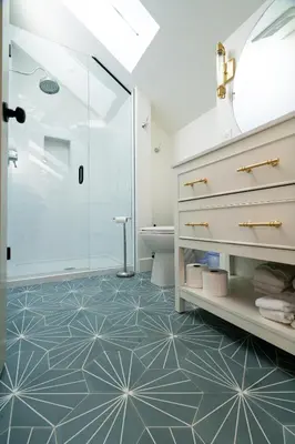 a bathroom with a shower and a toilet at 139 West Ellsworth in Denver