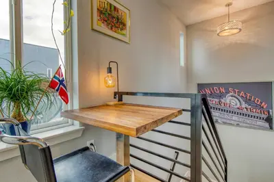 a small room with a table and a chair at Walk to Empower Field Townhome with Hot Tub! in Denver