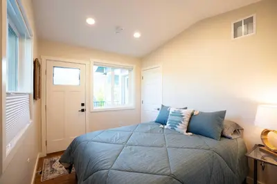 a bedroom with a bed and a window at Golden Cottage Near Red Rocks and School of Mines! in Golden