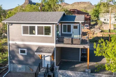 an aerial view of a house with a balcony at Golden Cottage Near Red Rocks and School of Mines! in Golden