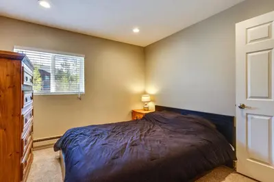 a bedroom with a bed and a dresser and a window at 15 Mi to Slopes Silverthorne Getaway! in Silverthorne