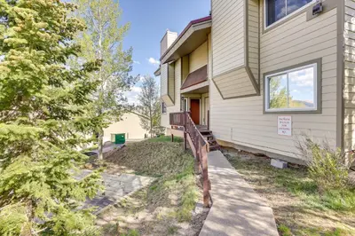 a house with a fence in front of it at 15 Mi to Slopes Silverthorne Getaway! in Silverthorne