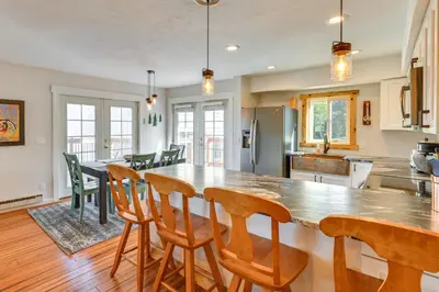a kitchen with a large table and chairs in it at 15 Mi to Slopes Silverthorne Getaway! in Silverthorne