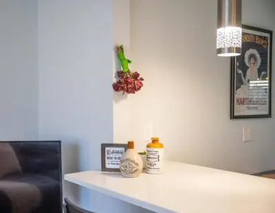 a room with a counter with two bottles on it at Modern Retreat With Patio & Sunset Views - Gray St in Arvada