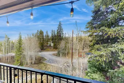 a view of a road from a balcony with lights at Rustic Relaxation in Winter Park in Winter Park