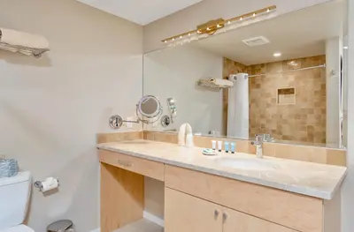 a bathroom with a sink and a mirror at Cliffview Luxury Vacation Rental at Windcliff home in Estes Park