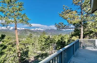 a balcony with a view of the mountains at Cliffview Luxury Vacation Rental at Windcliff home in Estes Park