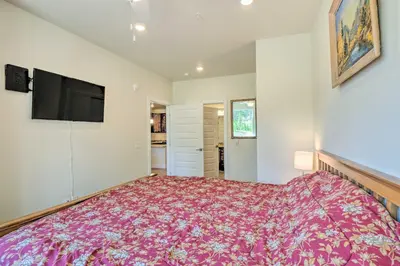 a bedroom with a large bed and a flat screen tv at Condo 2 Mi to Keystone Resort Relax Fireside! in Keystone