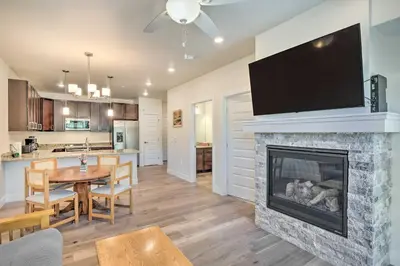 a living room with a fireplace with a tv above it at Condo 2 Mi to Keystone Resort Relax Fireside! in Keystone