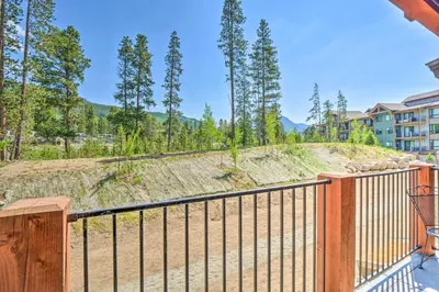 a balcony with a wooden fence and trees at Condo 2 Mi to Keystone Resort Relax Fireside! in Keystone