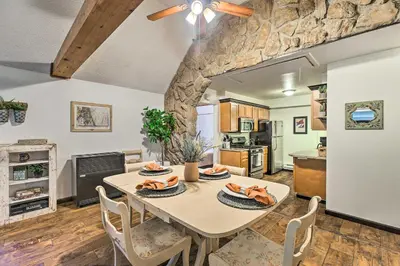 a kitchen and dining room with a table and chairs at Creekside Morrison Cabin about 9 Mi to Red Rocks Park! in Morrison