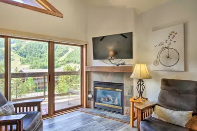 a living room with a fireplace and a tv at Less Than 1 Mi to Slopes Mtn-View Keystone Condo in Dillon