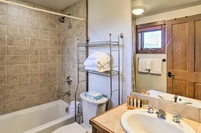 a bathroom with a sink and a toilet and a tub at Less Than 1 Mi to Slopes Mtn-View Keystone Condo in Dillon