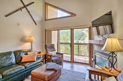 a living room with a couch and a fireplace at Less Than 1 Mi to Slopes Mtn-View Keystone Condo in Dillon