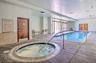 a large pool with a hot tub in a building at Less Than 1 Mi to Slopes Mtn-View Keystone Condo in Dillon
