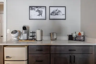 a kitchen with a white counter top and a counter at Winter Park Chateau in Winter Park