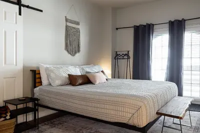 a bedroom with a bed and a window at Winter Park Chateau in Winter Park