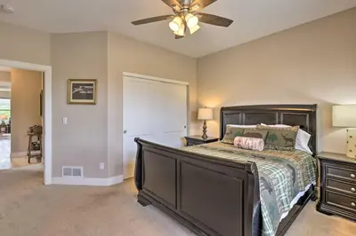 a bedroom with a bed and a ceiling fan at 3 Mi to Granby Ranch Home with Hot Tub and Mtn Views! in Granby