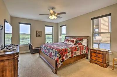 a bedroom with a bed and a ceiling fan at 3 Mi to Granby Ranch Home with Hot Tub and Mtn Views! in Granby
