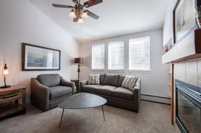 a living room with two couches and a fireplace at Premium Unit 3620 - Studio - Fraser Crossing Founders Pointe condo in Winter Park