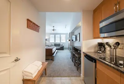 a kitchen and a living room with a couch at Premium Unit 3620 - Studio - Fraser Crossing Founders Pointe condo in Winter Park