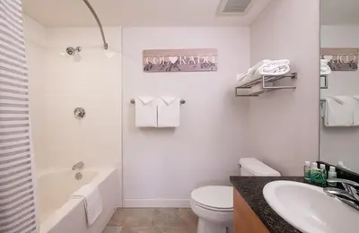 a bathroom with a tub and a toilet and a sink at Premium Unit 3620 - Studio - Fraser Crossing Founders Pointe condo in Winter Park