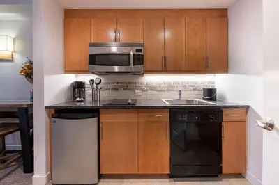 a kitchen with a microwave and a stove and a sink at Premium Unit 3620 - Studio - Fraser Crossing Founders Pointe condo in Winter Park