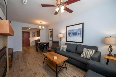 a living room with a couch and a table at Premium Unit 4568 - One Bedroom withKitchenette - Fraser Crossing Founders Pointe condo in Winter Park