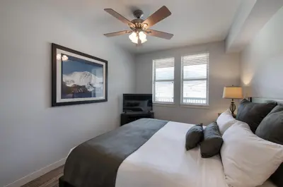 a bedroom with a bed and a ceiling fan at Premium Unit 4568 - One Bedroom withKitchenette - Fraser Crossing Founders Pointe condo in Winter Park
