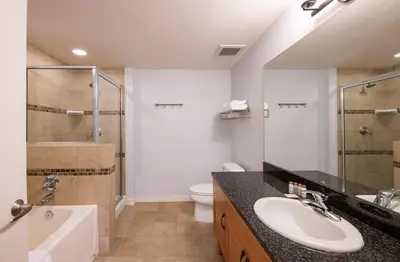 a bathroom with a sink and a shower and a toilet at Premium Unit 4568 - One Bedroom withKitchenette - Fraser Crossing Founders Pointe condo in Winter Park