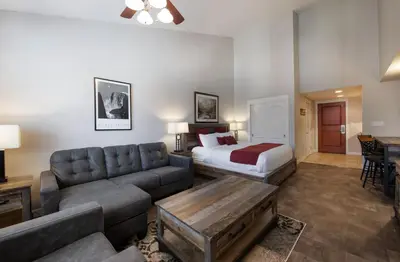 a living room with a couch and a bed in a room at Premium Unit 4667 - Studio - Fraser Crossing Founders Pointe condo in Winter Park