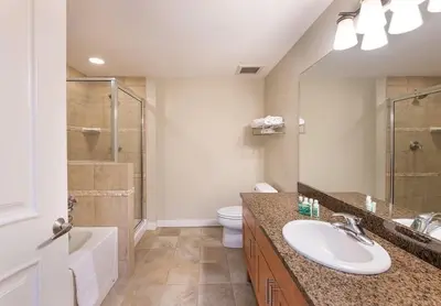 a bathroom with a sink and a shower and a toilet at Premium Unit 4547 - One Bedroom withKitchenette - Fraser Crossing Founders Pointe condo in Winter Park