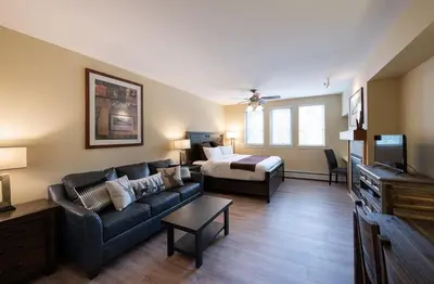 a living room with a couch and a bed at Winter Park FF Premium-Rated 4443 in Winter Park