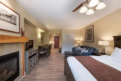 a hotel room with a bed and a fireplace at Winter Park FF Premium-Rated 4443 in Winter Park