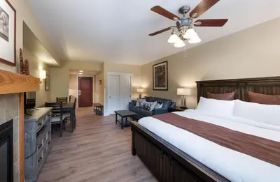 a hotel room with a bed and a living room at Winter Park FF Premium-Rated 4443 in Winter Park