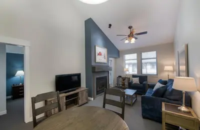 a living room with a couch and a tv at Winter Park FF Premium-Rated 3619 in Winter Park