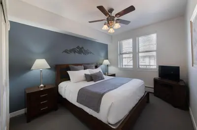 a bedroom with a bed and a ceiling fan at Winter Park FF Premium-Rated 3619 in Winter Park