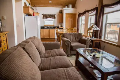 a living room with a couch and a table at Old Man Mountain, Spacious lodge with loft Great for families, Dogs allowed in Estes Park