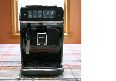 a black coffee maker is sitting on a table at Sundance Suite, 1 Bedroom with fireplace Dogs OK in Estes Park
