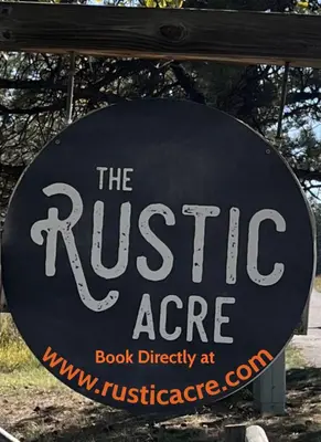 a sign for the rustic age book directory at theresartifacts at Mummy Mtn Suite 1 Bedroom suite with fireplace and jacuzzi tub in Estes Park