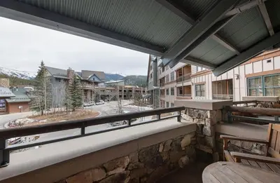 a large balcony with a view of a town at Zephyr Mountain Lodge Premium-Rated 1214 in Winter Park